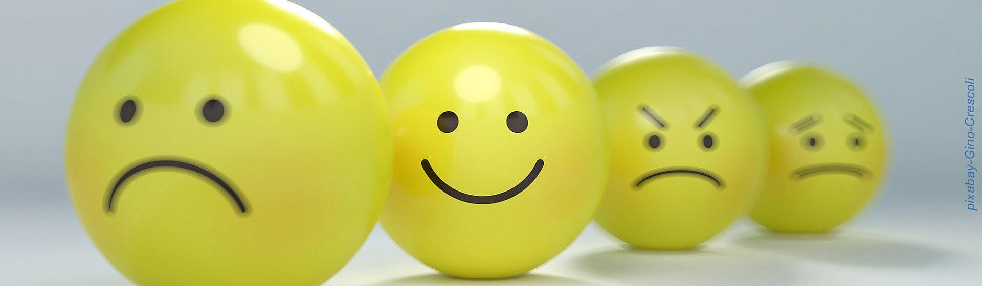 Gelbe Bälle mit Gesichtern in unterschiedlichen Emotionen. Gelbe Bälle mit Gesichtern in unterschiedlichen Emotionen.